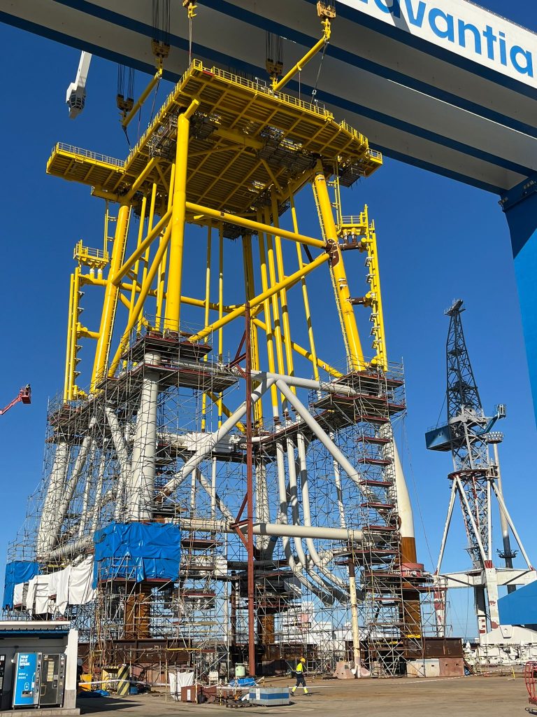 A towering steel structure presides over Puerto Real Shipyard. This is a jacket for a substation destined for an offshore wind farm in France.